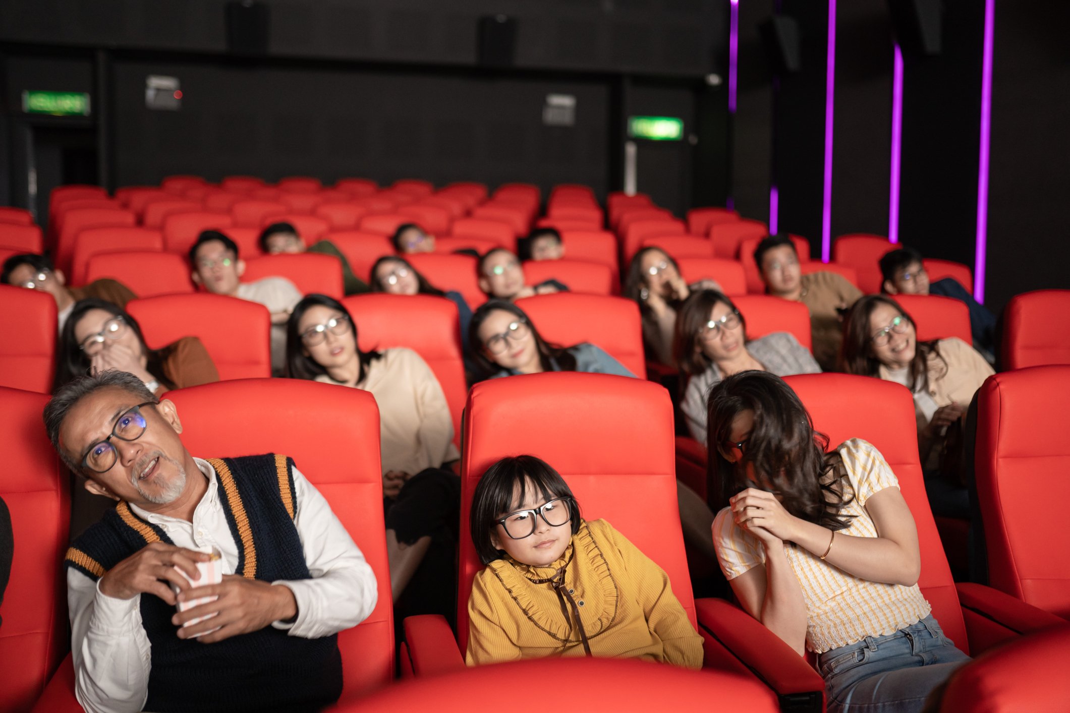 An audience enjoying a film in a movie theater.