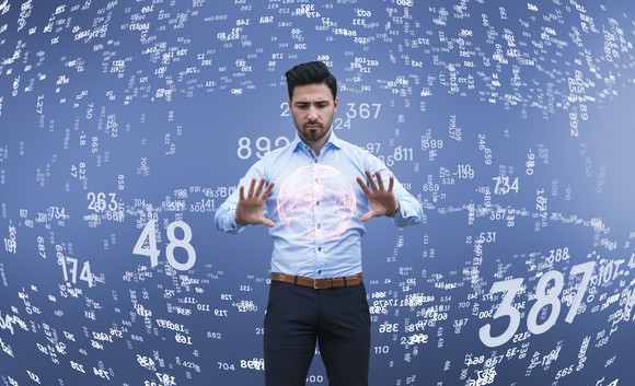 Man analyzing large amounts of data.