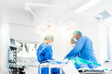 A team of surgeons performs a surgery
