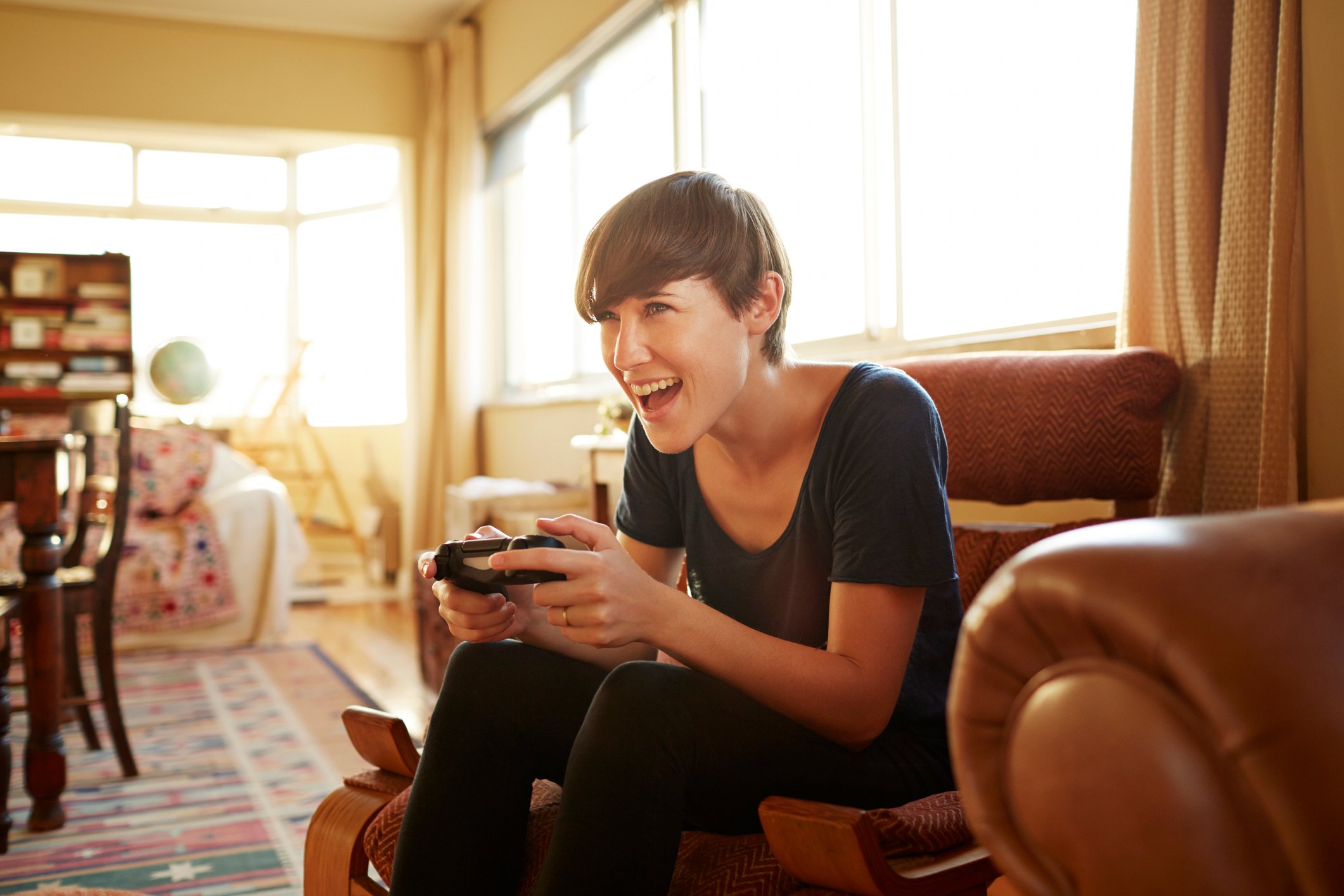 A person plays a video game at home.