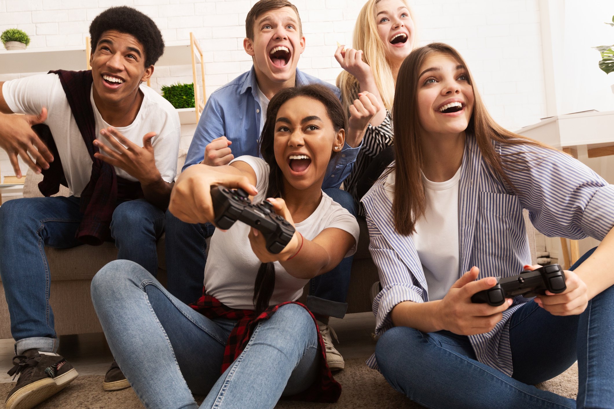 Smiling friends playing video game.