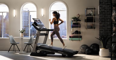 woman using nordictrack treadmill