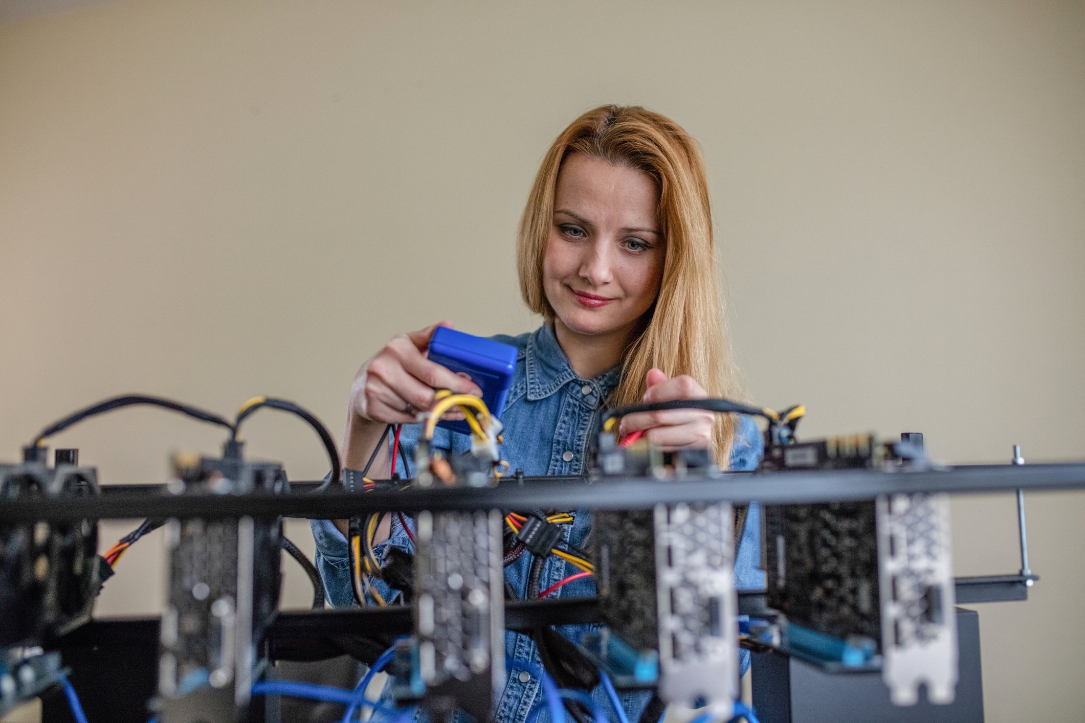 Person constructing a mining rig. 