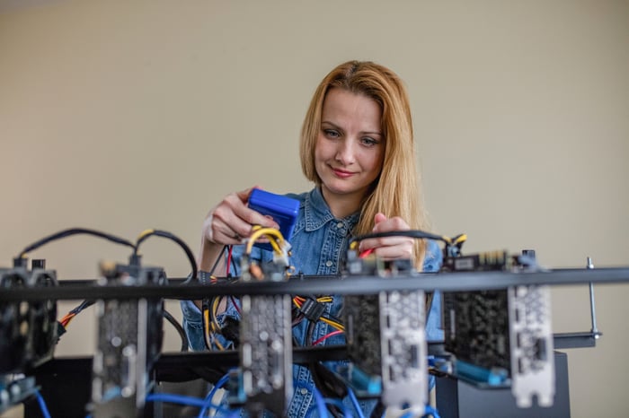 Person constructing a mining rig. 