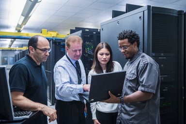Colleagues working together in a data center