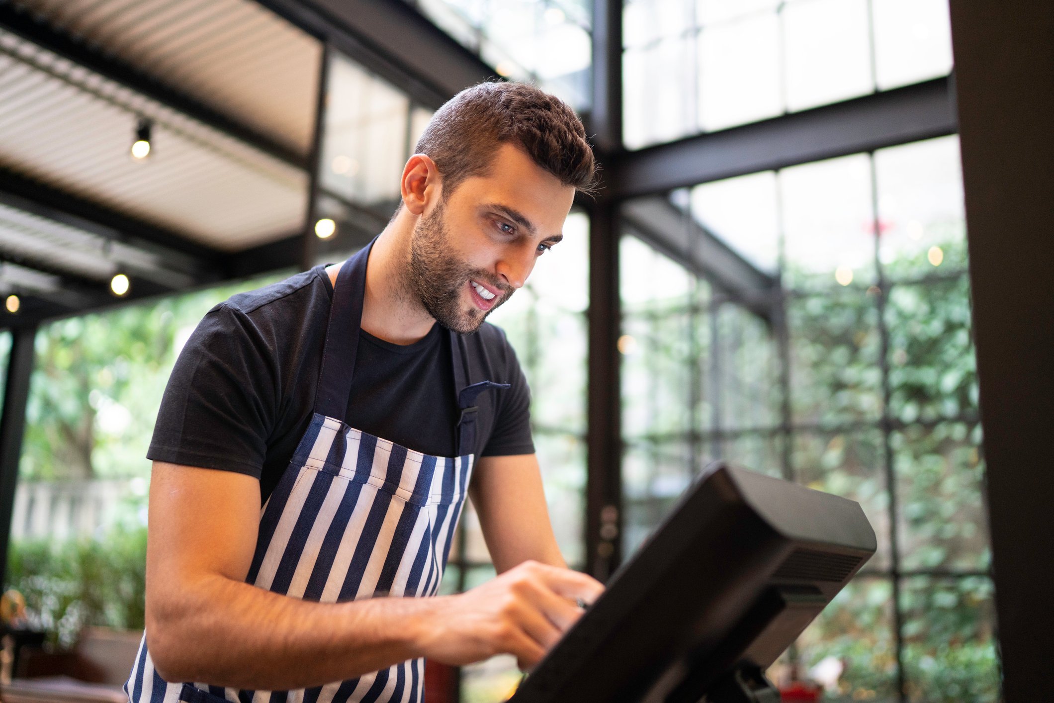 restaurant employee using a computer terminal
