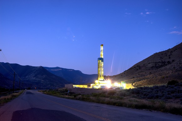 A shale oil rig lit up at night. 