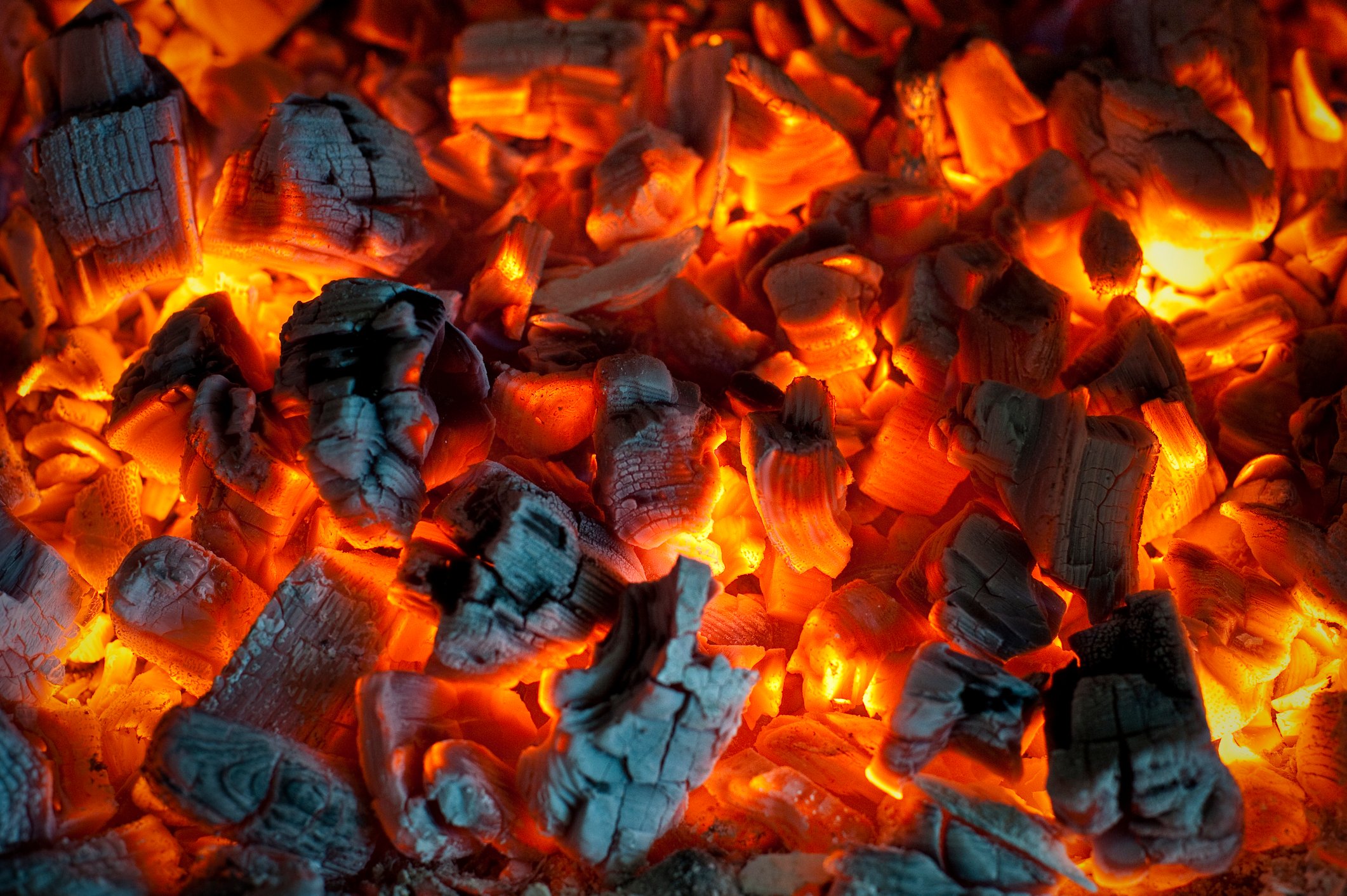 A closeup of burning red hot coal.