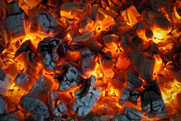 A closeup of burning red hot coal.
