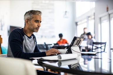 Person looking intently at laptop screen
