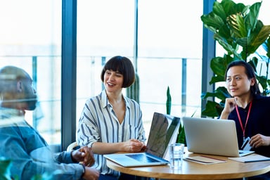 employees sitting around a table
