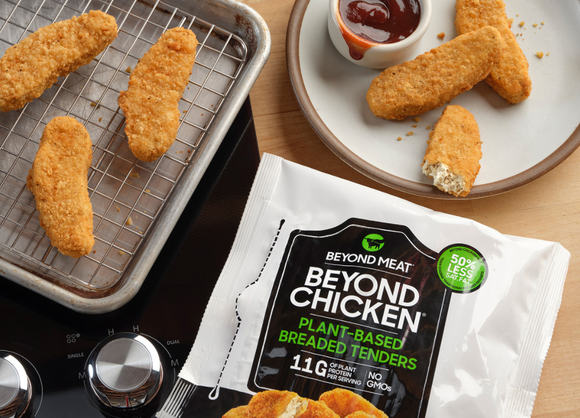 A bag of Beyond Chicken tenders, with tenders on a plate and a pan.