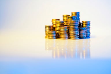 several piles of gold coins