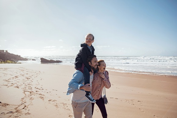 A family spending time at the beach.