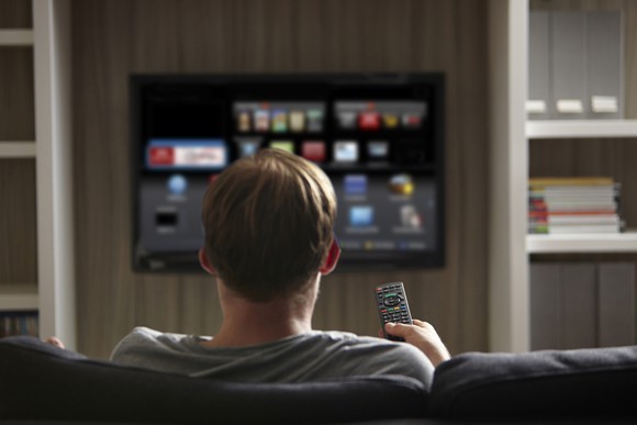 A person is watching content on a smart TV.