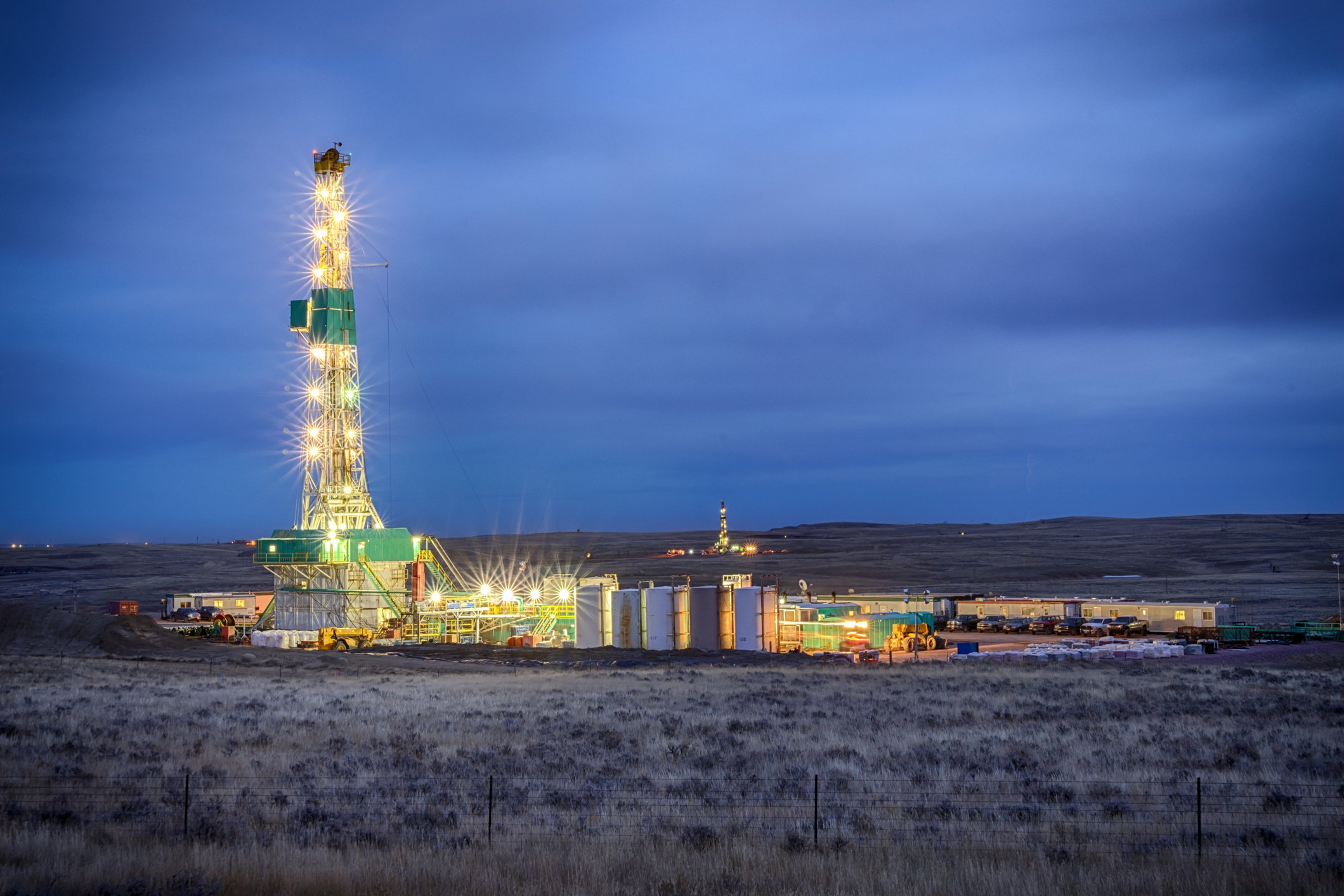 A shale rig lit up at night. 