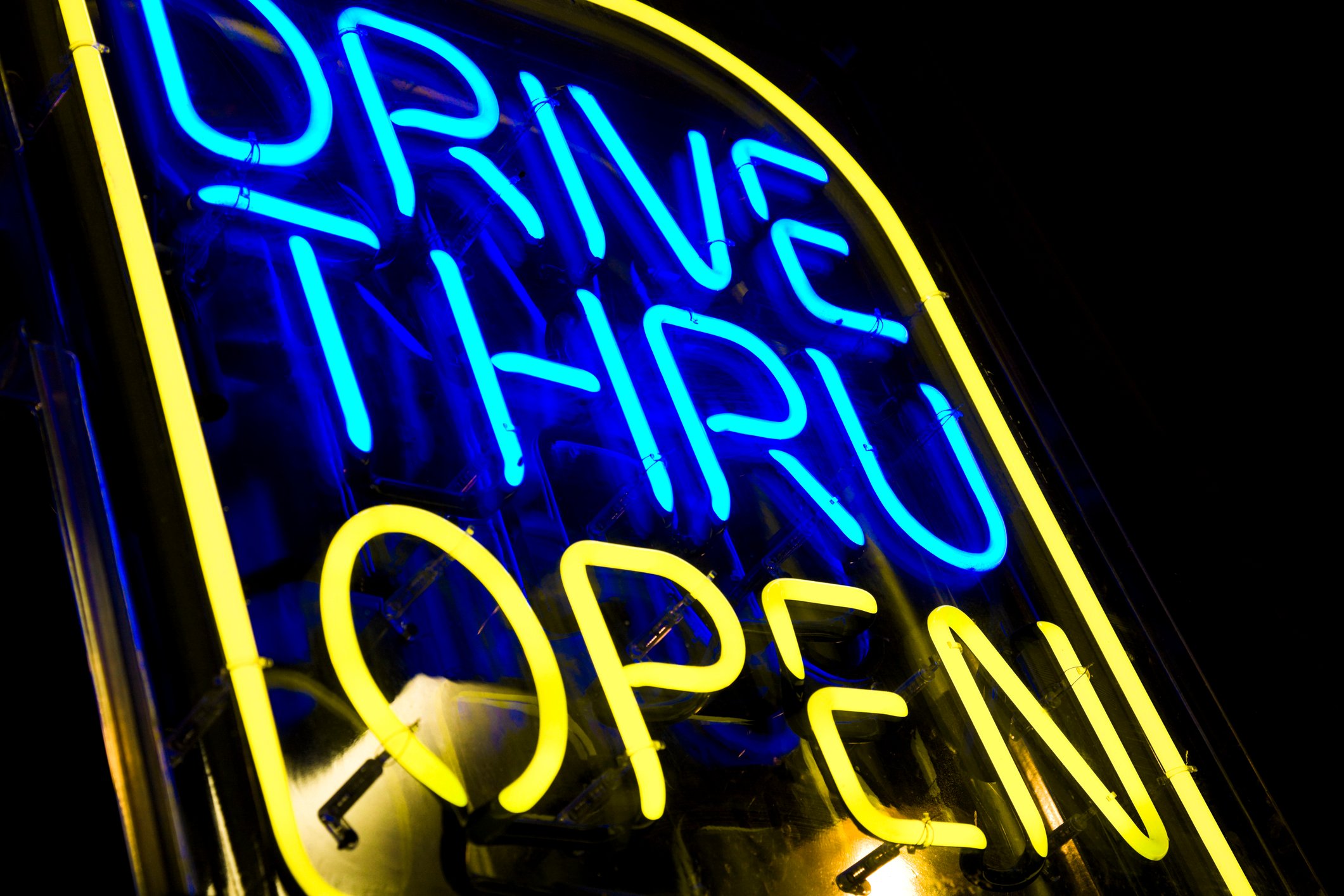 A drive thru neon sign.
