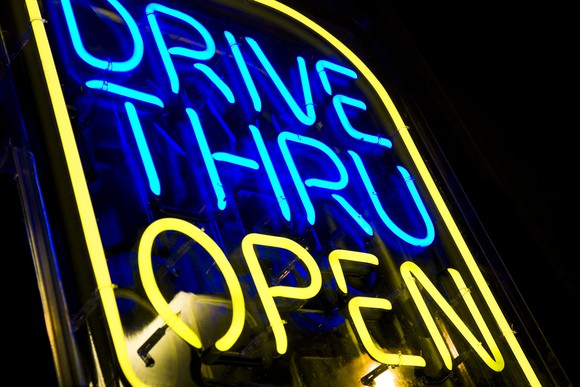 A drive thru neon sign.