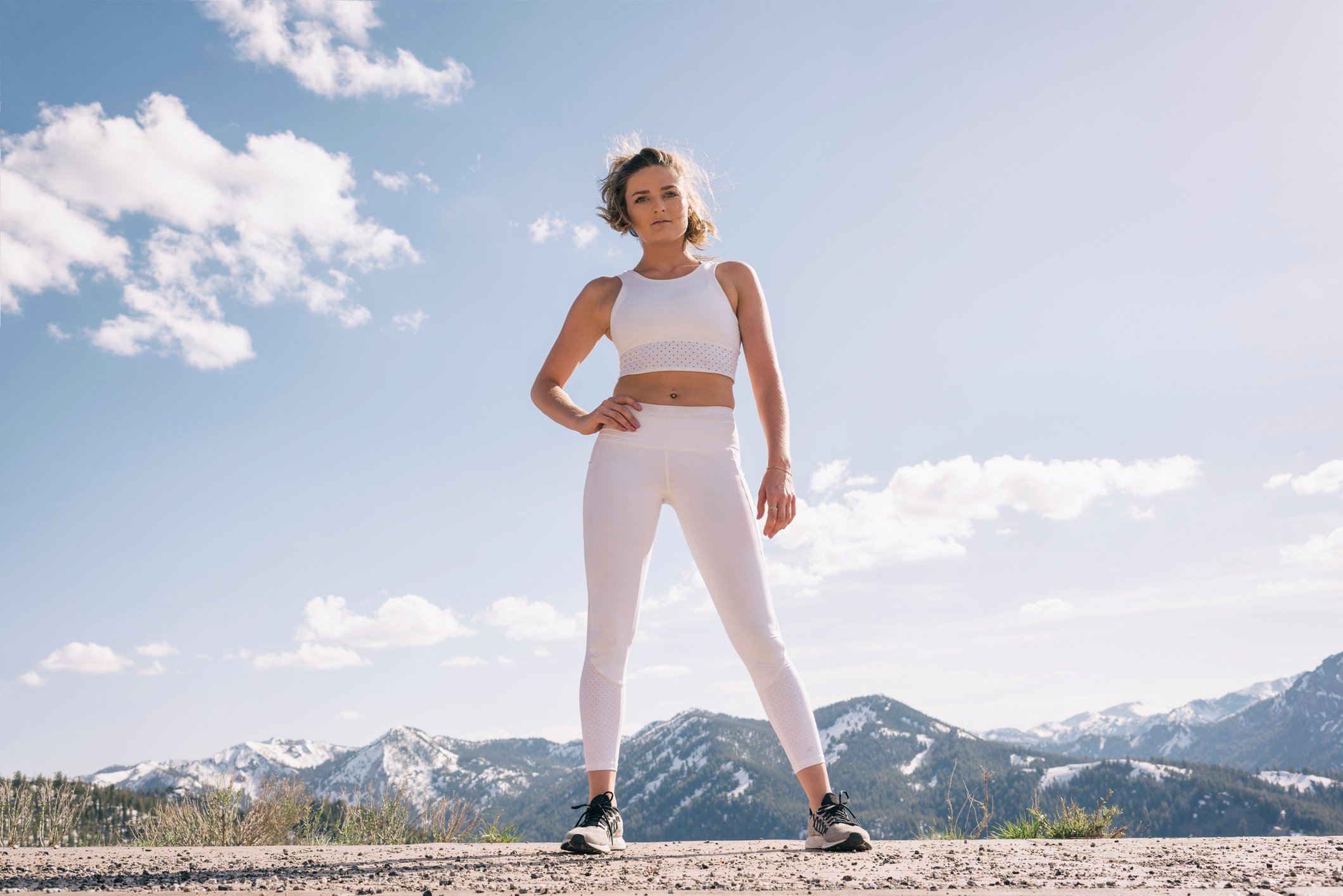 Person standing outside wearing athletic clothing.