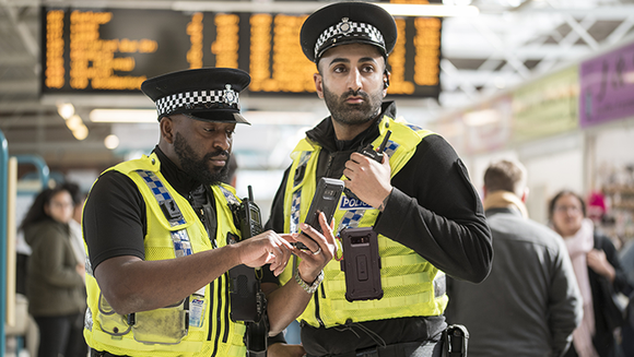 Police officers wearing body cameras