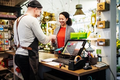 A woman paying in a store