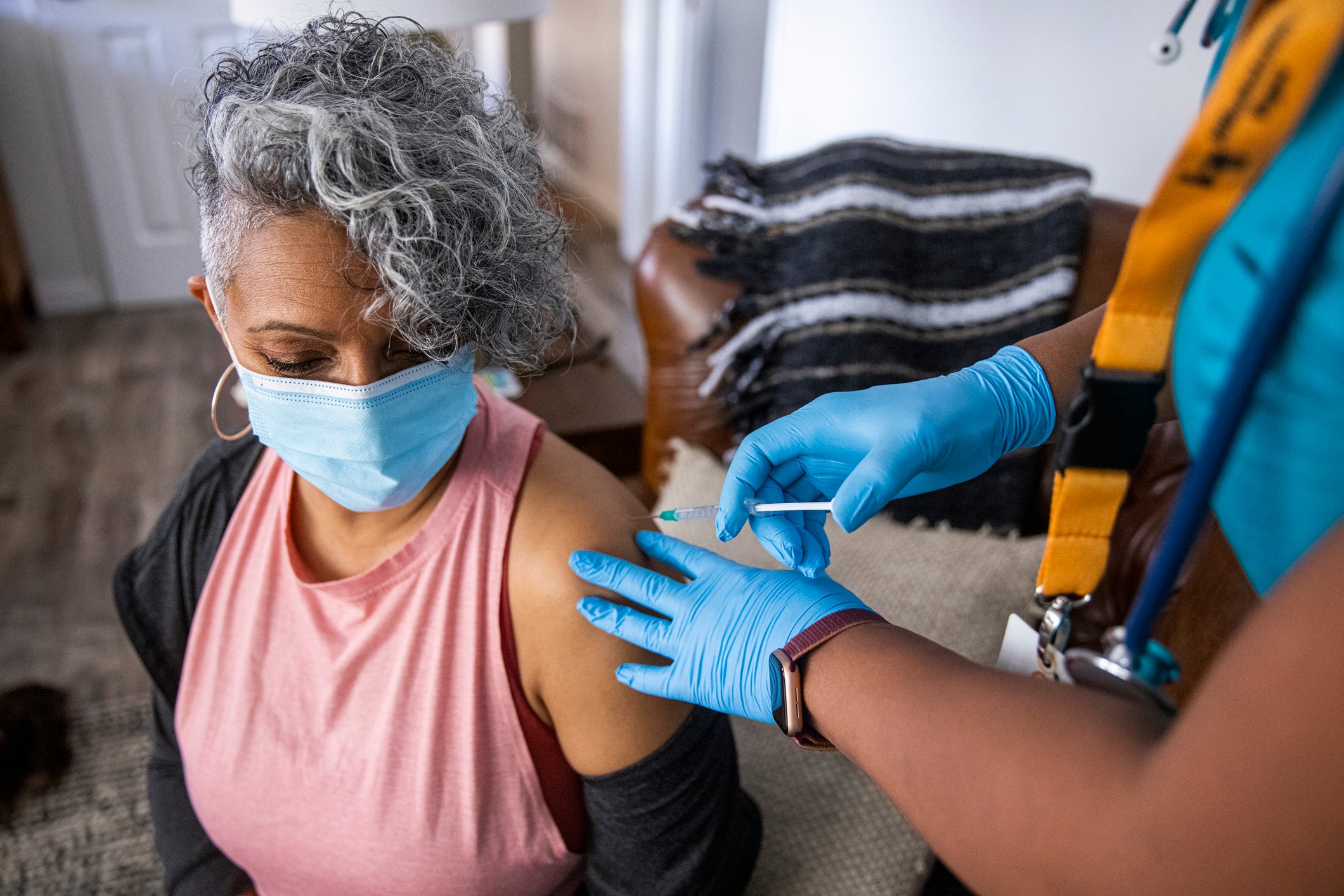 A patient getting a vaccine in a clinic.
