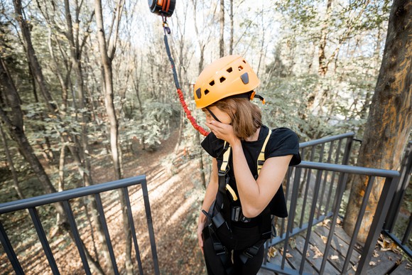Person looking nervous before jumping with bungee cord.