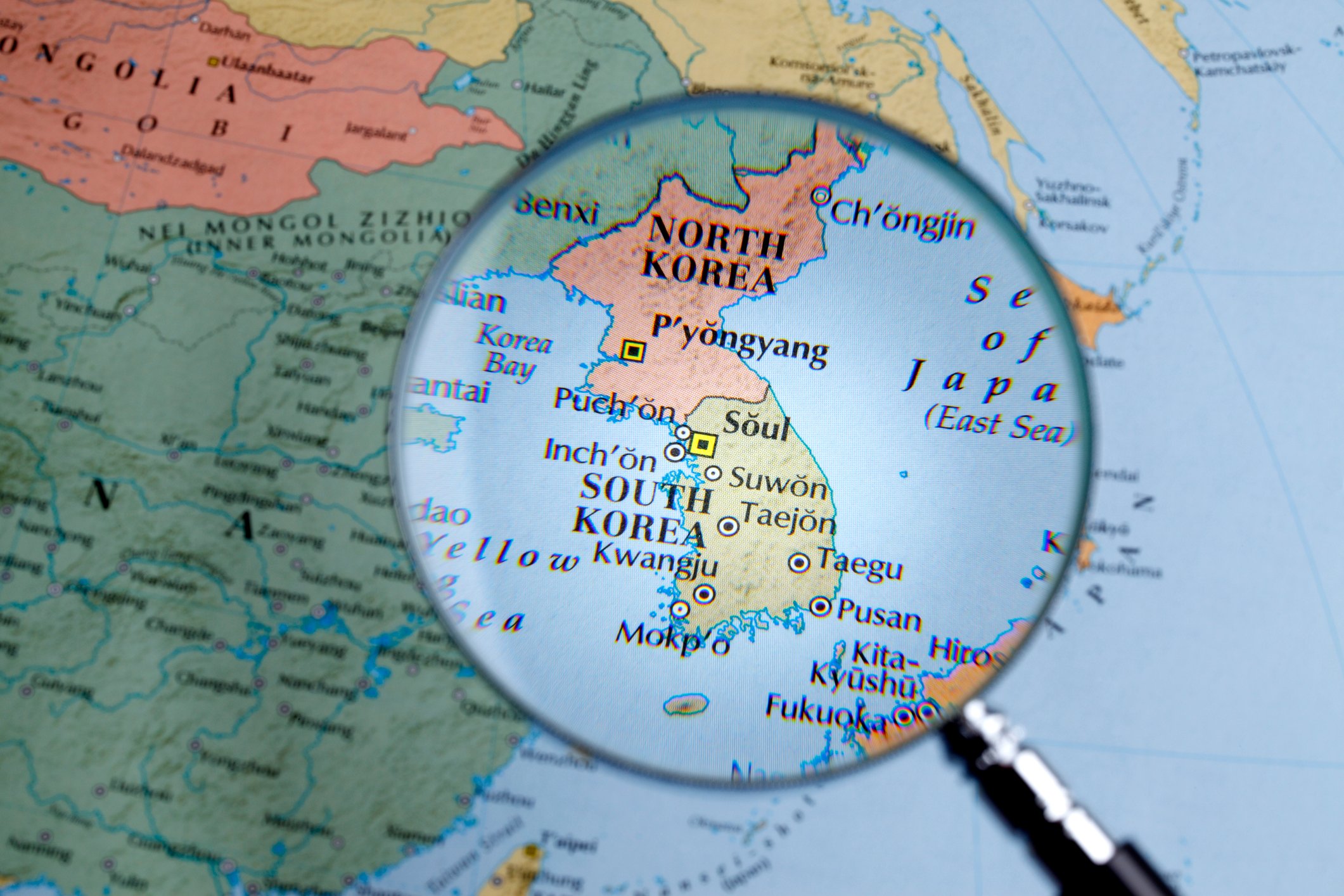 Map of North and South Korea under a magnifying glass