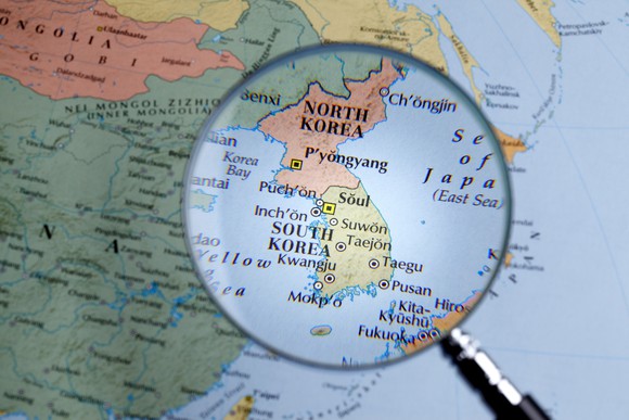 Map of North and South Korea under a magnifying glass