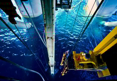 A person working at an offshore oil drilling site.