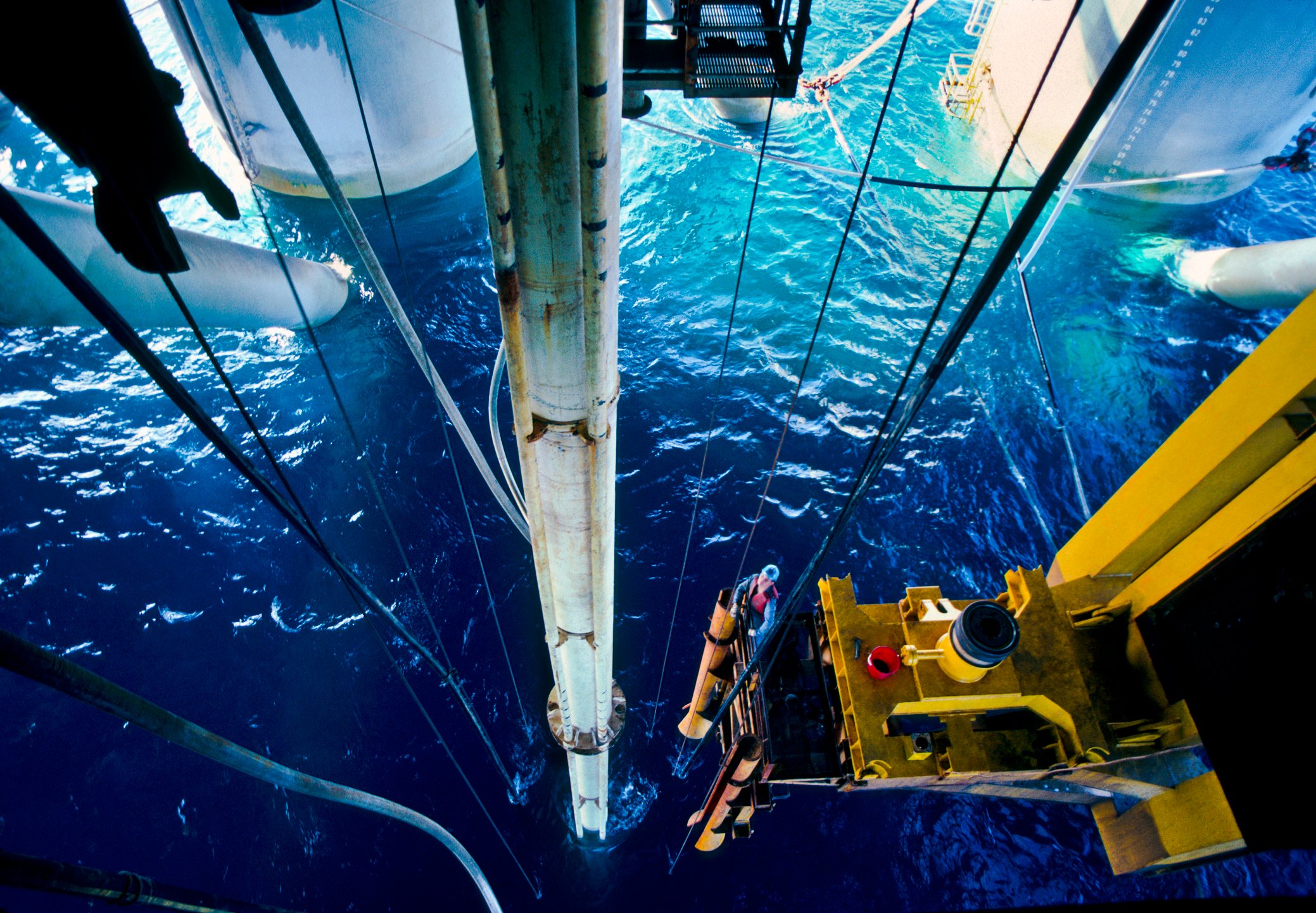 A person working at an offshore oil drilling site.