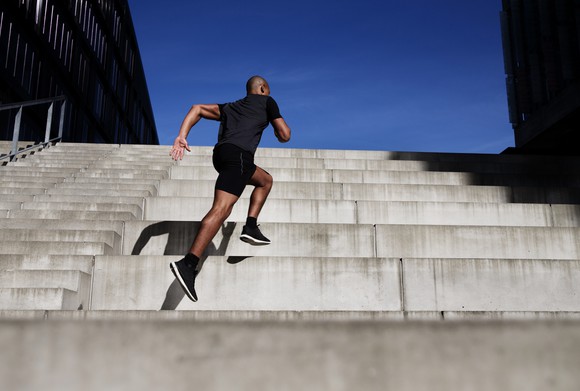Person running up the stairs.