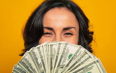 Woman-smiles-money-fan