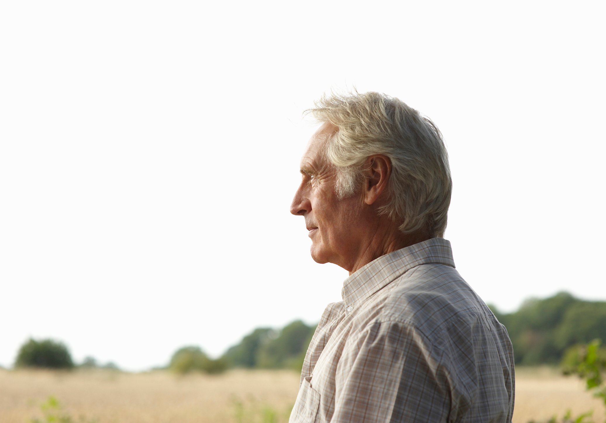 Person outdoors looking into the distance.