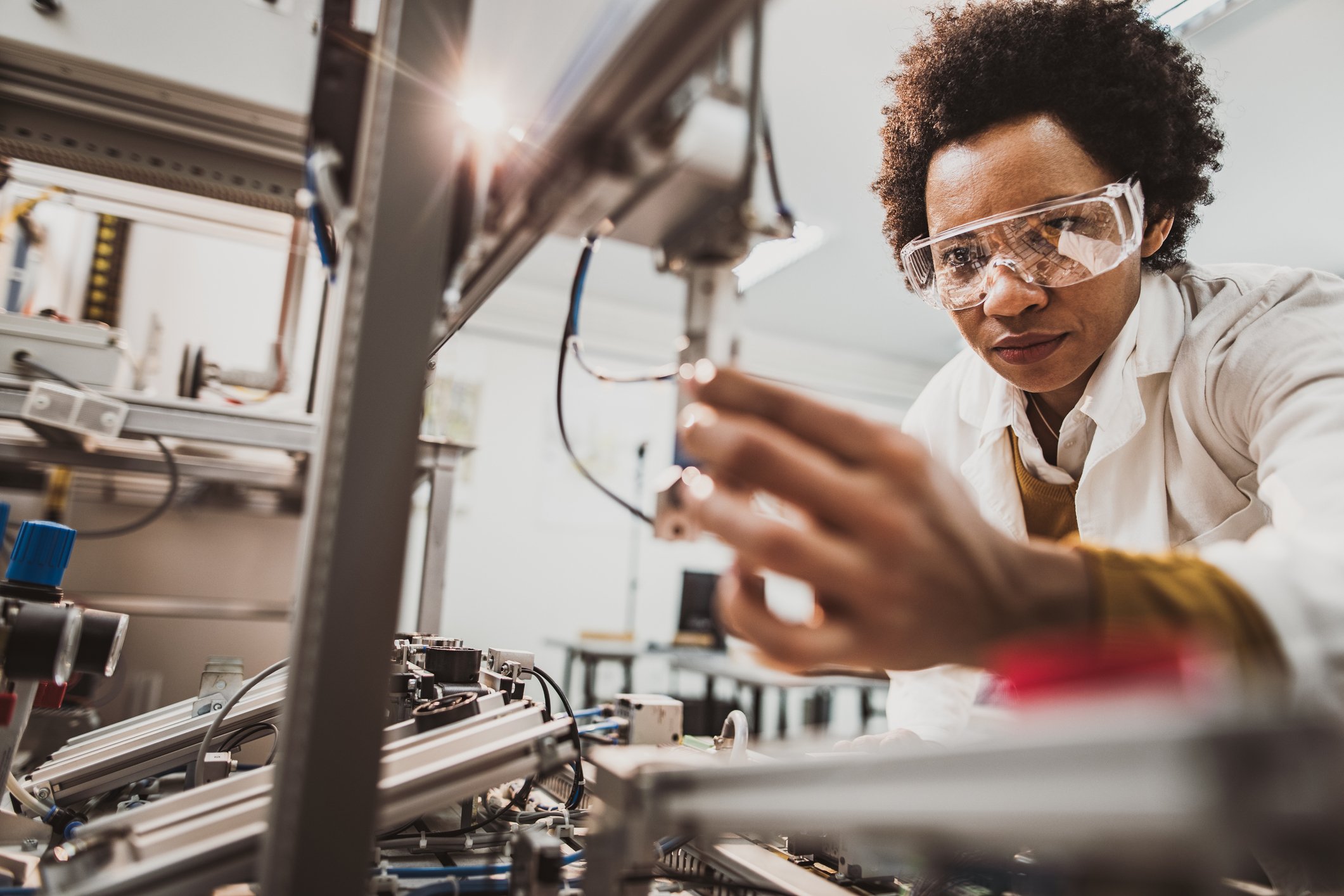 A close-up of a person working in a laboratory. 