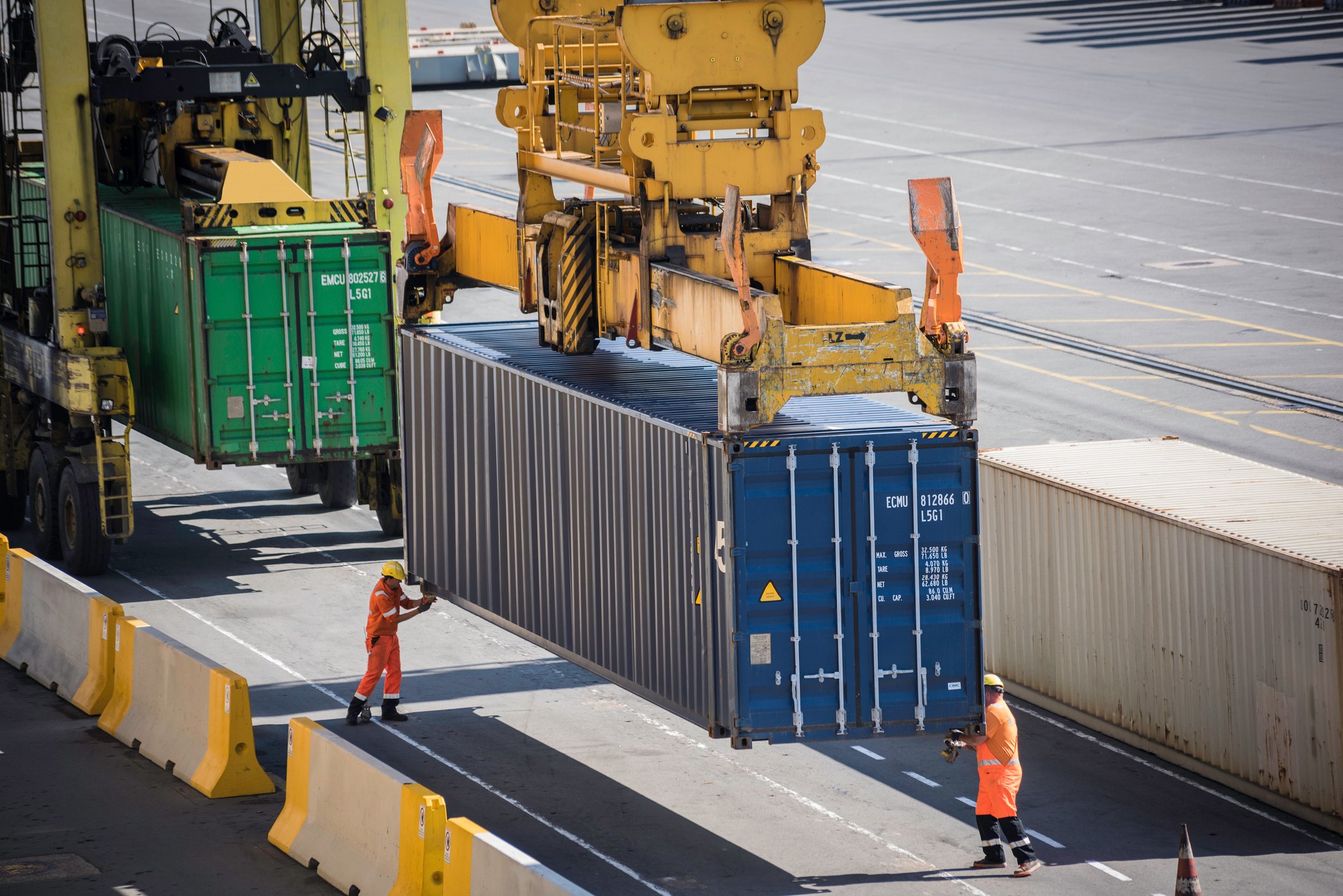 Container being unloaded from ship