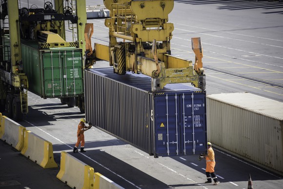 Container being unloaded from ship