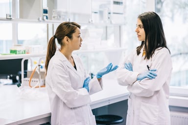 two scientists chat in laboratory