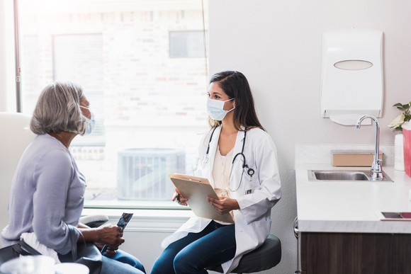A doctor meets with a patient.
