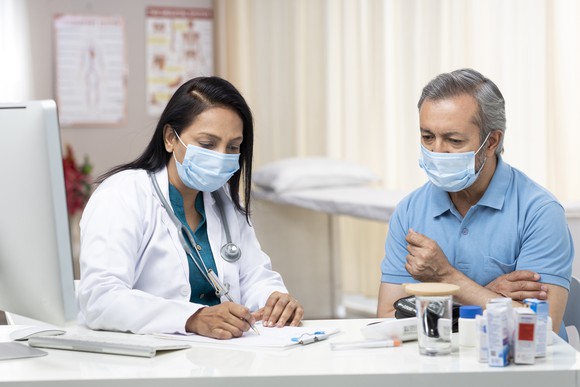 Doctor and patient in office.