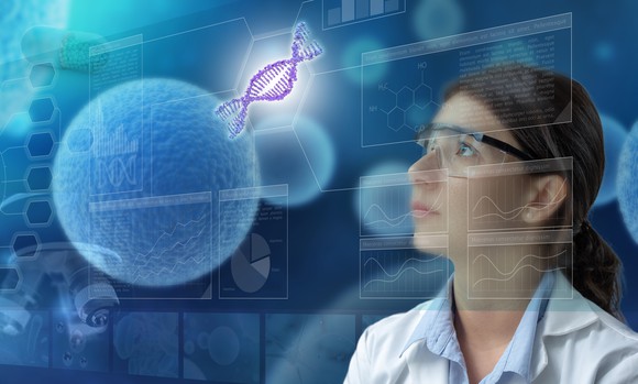 A scientist looks at a double-stranded DNA helix floating in the air.
