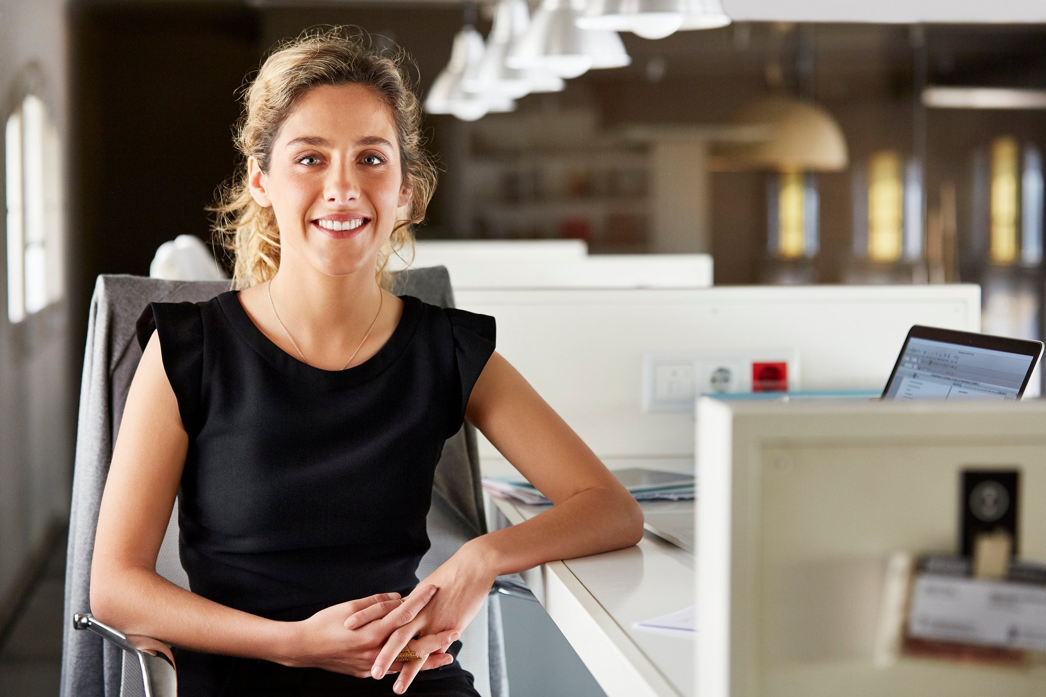 Smiling person at desk