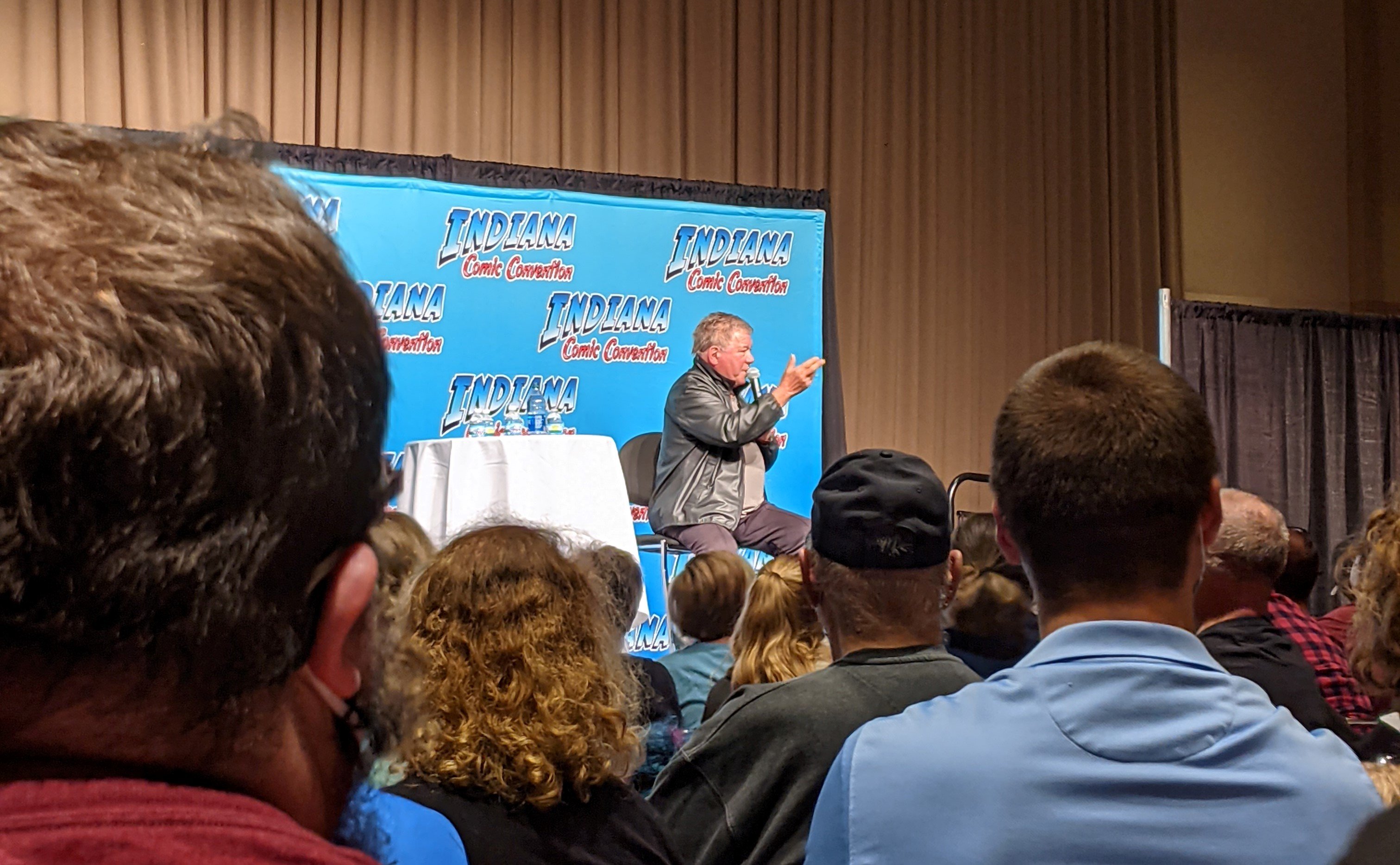 William Shatner addressing an audience at ComicCon Indy.