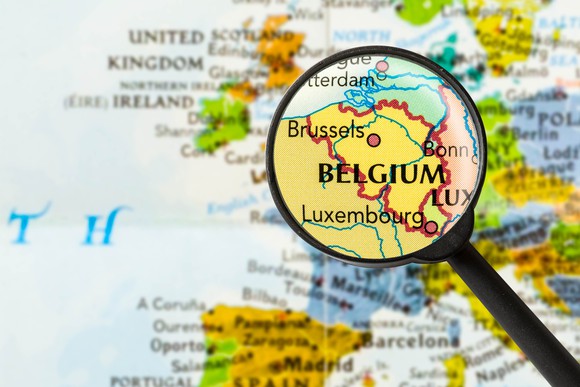 Map of Belgium under a magnifying glass.