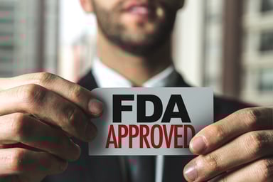FDA approved card held by man