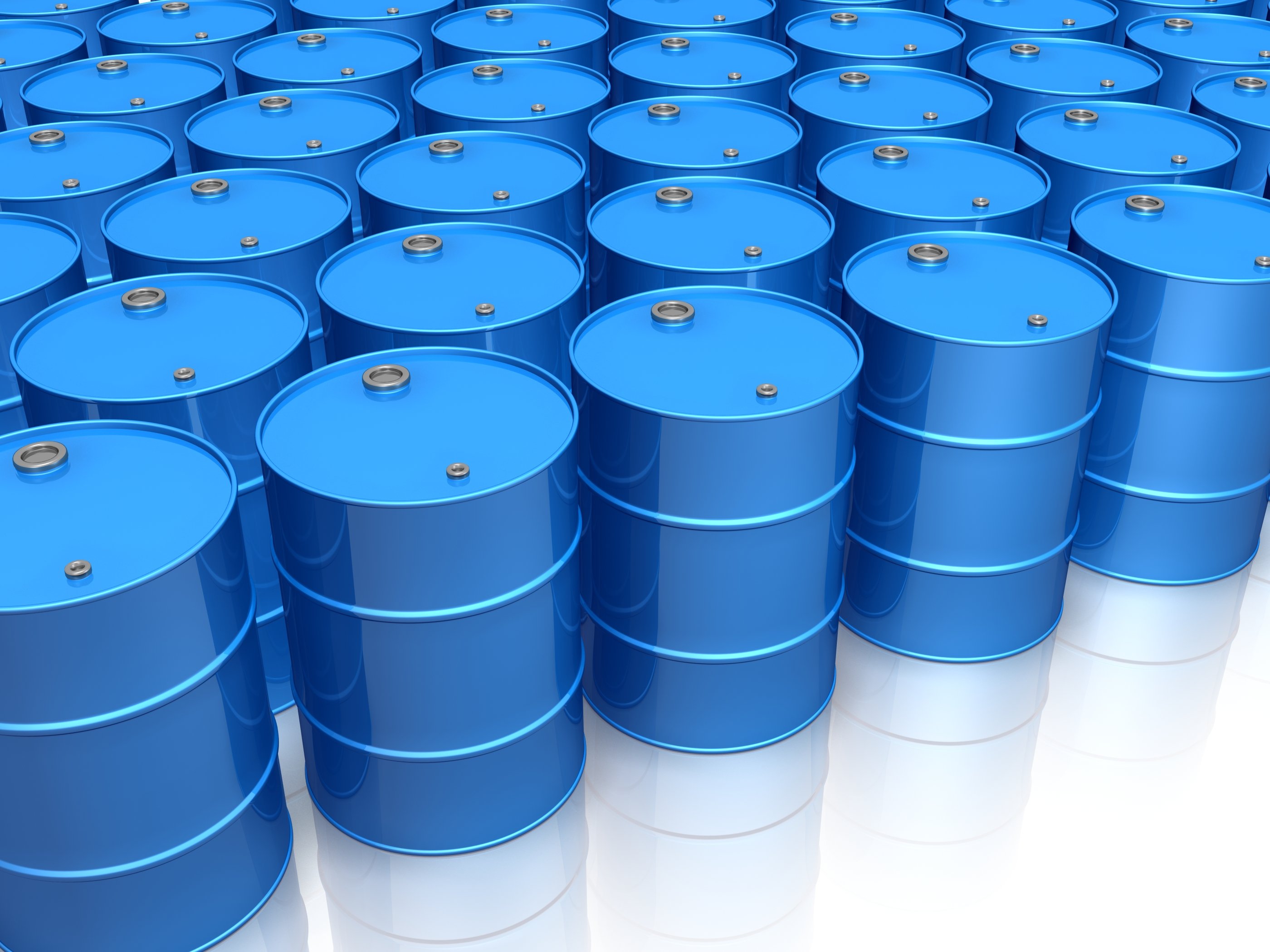Dozens of blue oil barrels.
