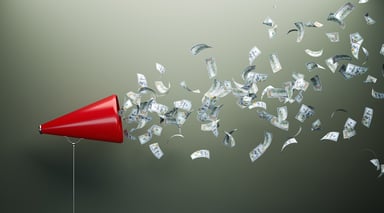 Megaphone and hundred-dollar bills