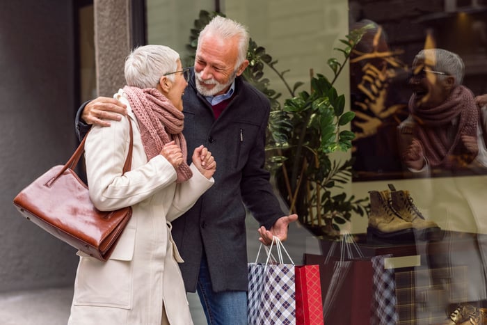 Excited couple shopping together. 