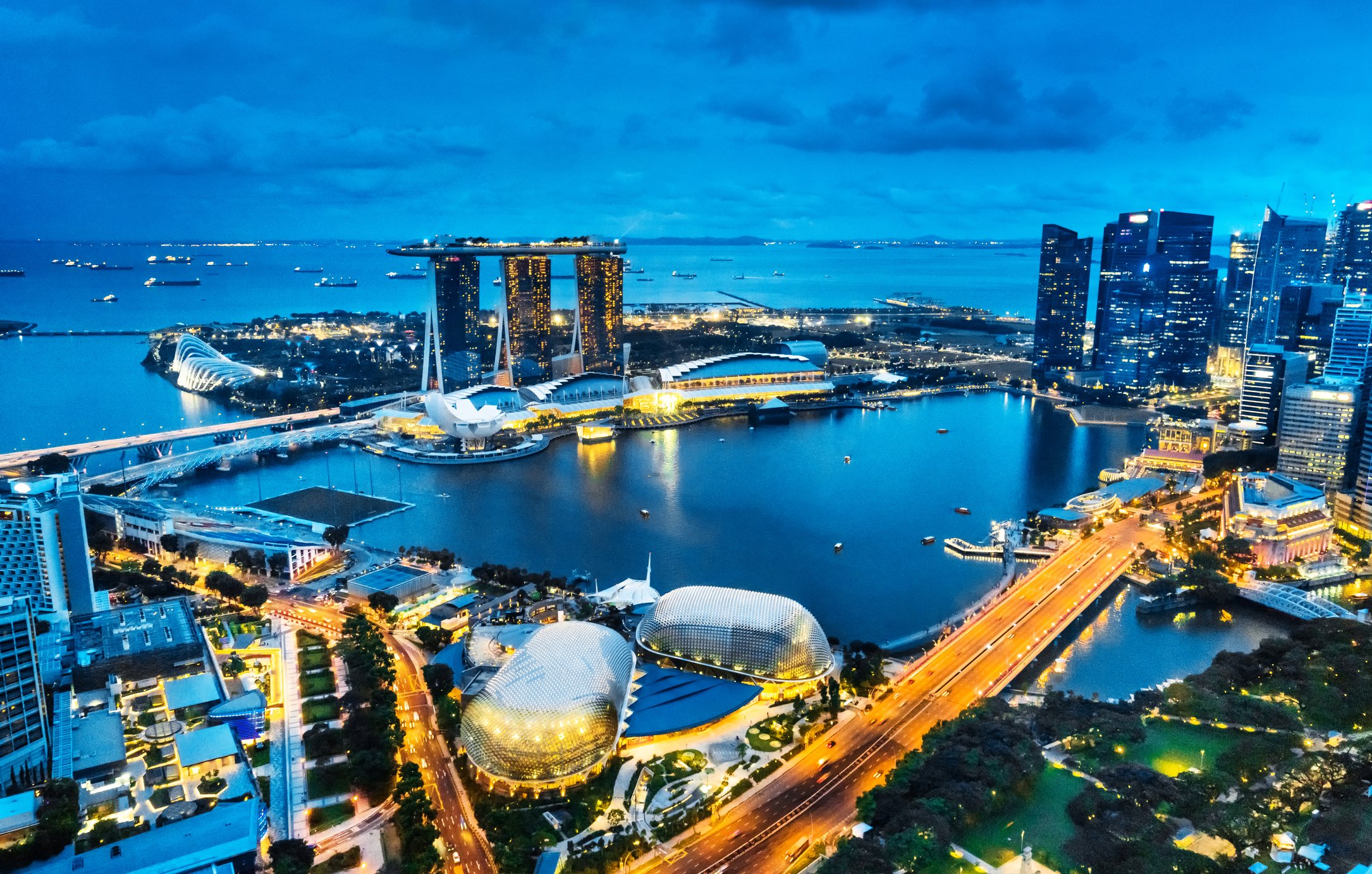 An aerial view of evening lights at Marina Bay in Singapore.