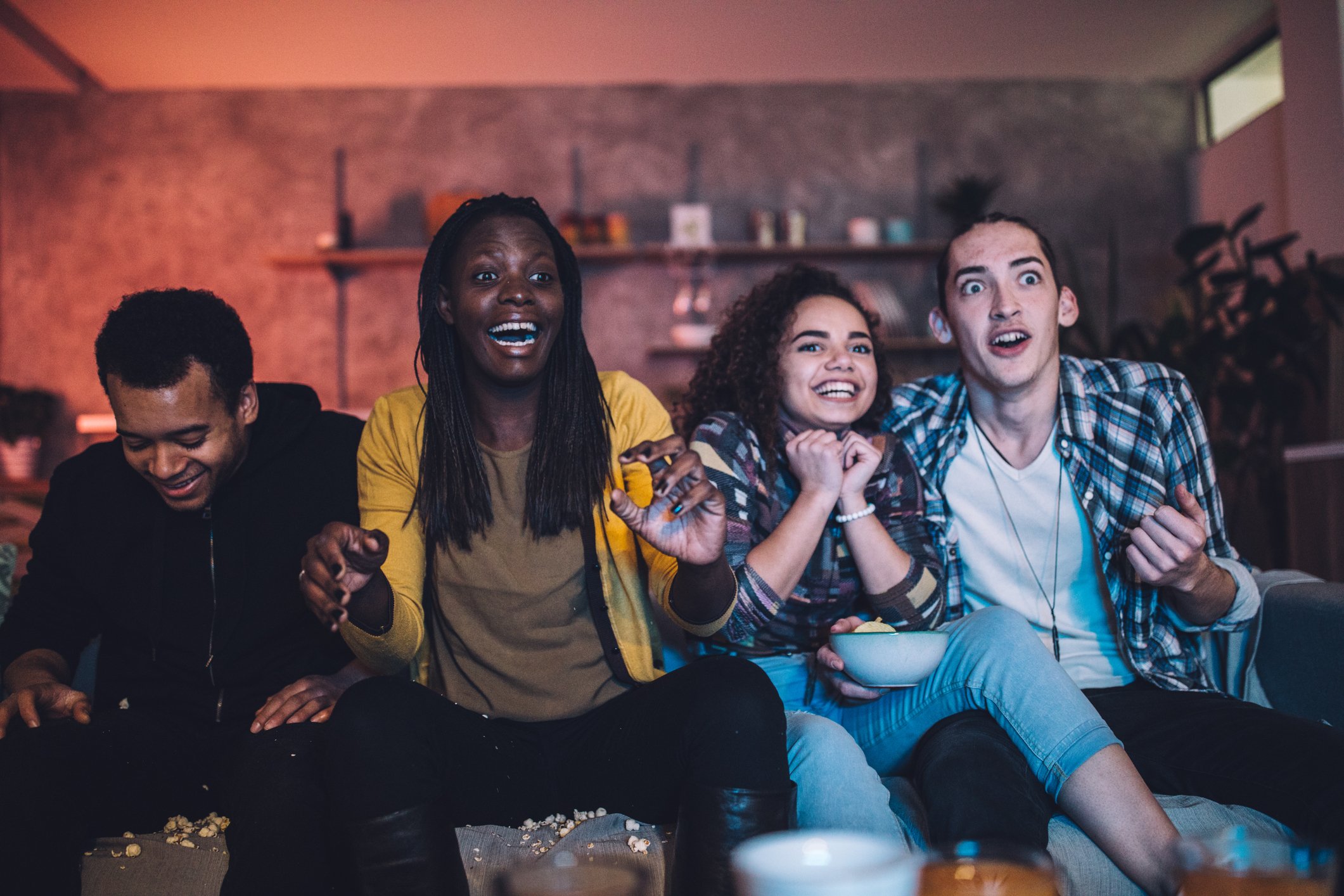 Group of friends watching TV together.